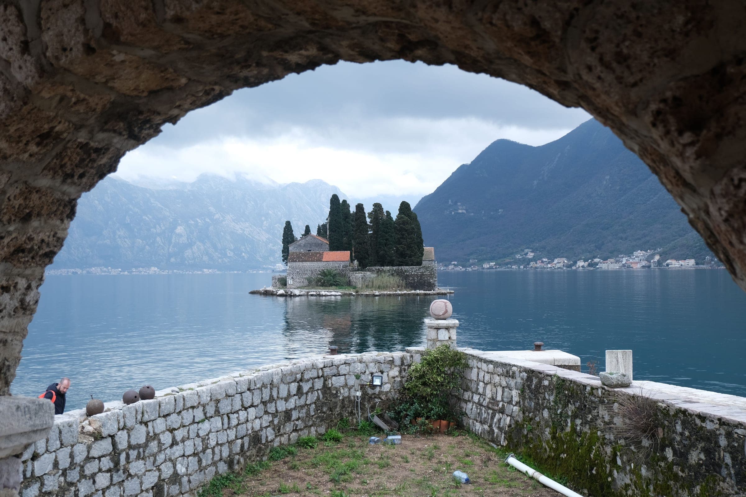 The island of St George off Perast, seen through a stone arch